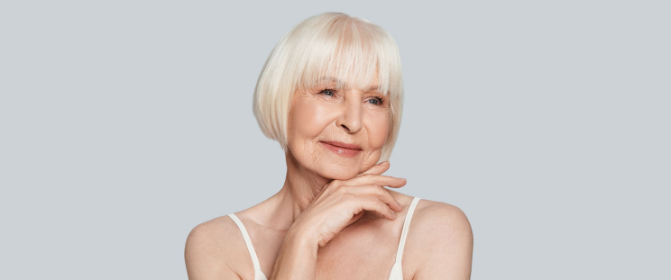 A woman with mature skin posing for the camera.