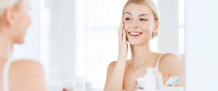 Woman with healthy skin after regular maintenance with at home skincare.