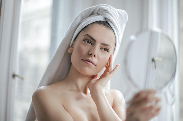 Female patient noticing the results of laser treatment
