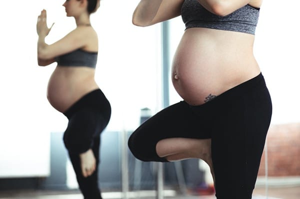 Pregnant women doing yoga