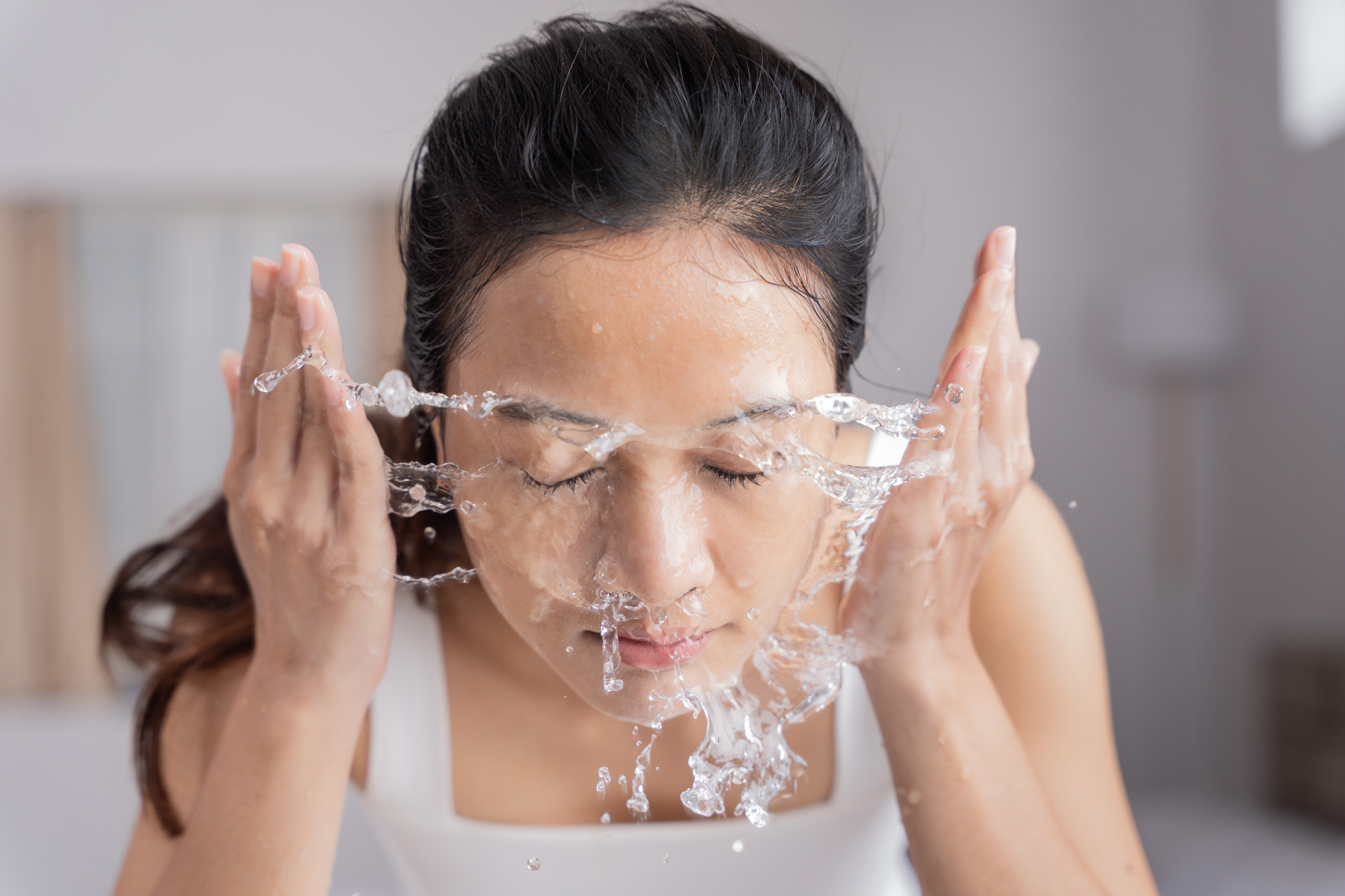  A woman cleansing her face
