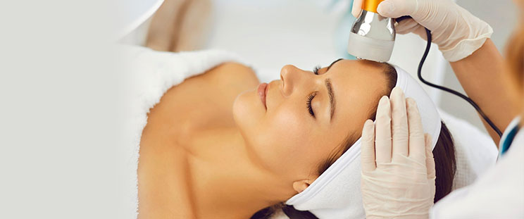A patient getting a laser skin firming treatment