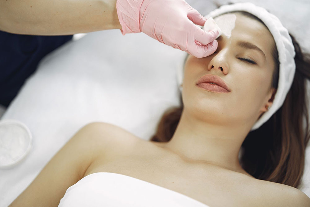 Numbing cream being applied to a patient before a laser treatment

