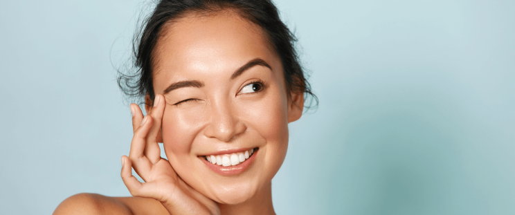A woman with a glowing complexion after undergoing dull skin treatment