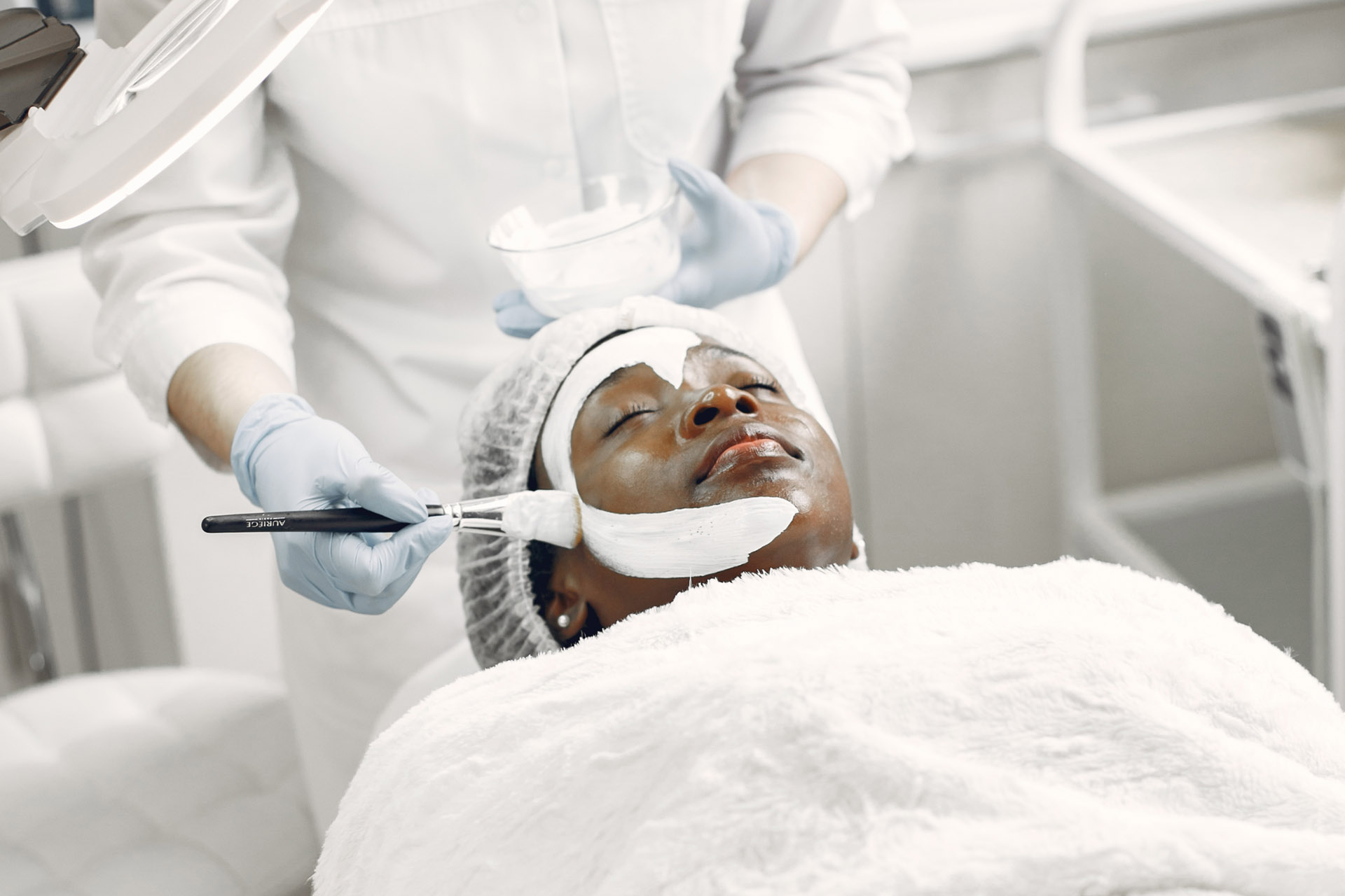 A specialist applying treatment on a patient.