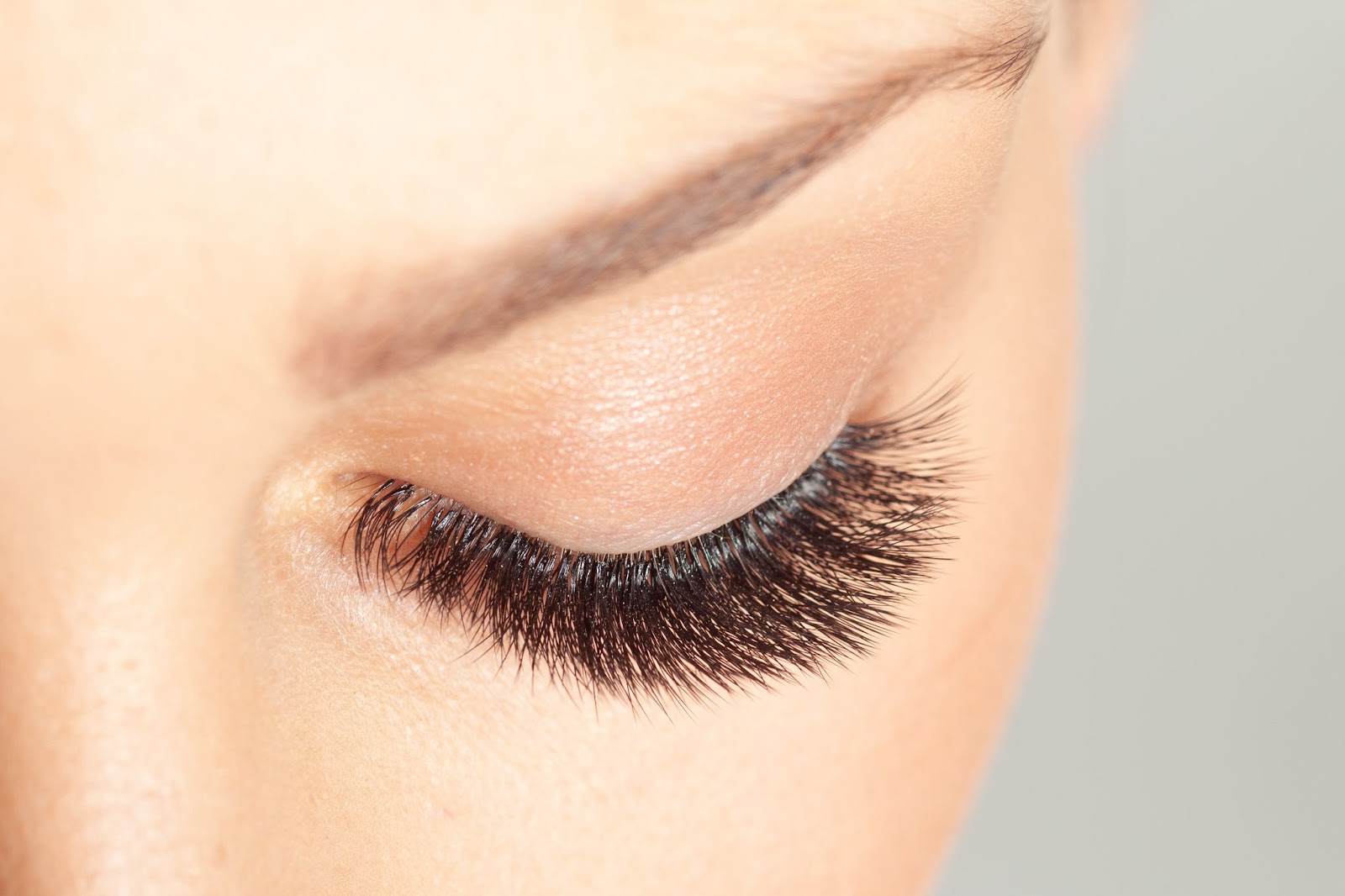 A woman with long, thick, and dark eyelashes