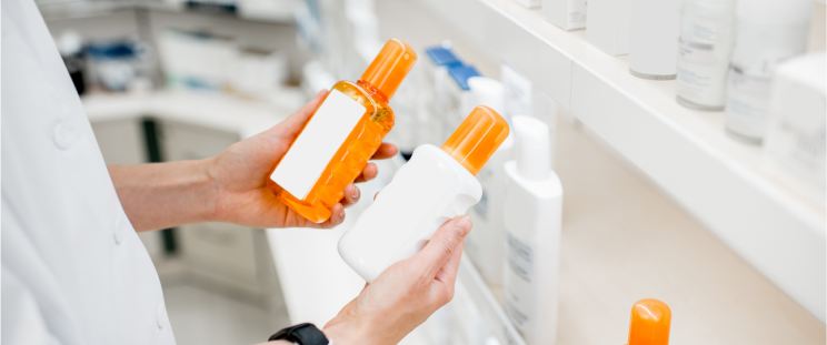 A consumer checking the ingredients in sunscreen before purchasing