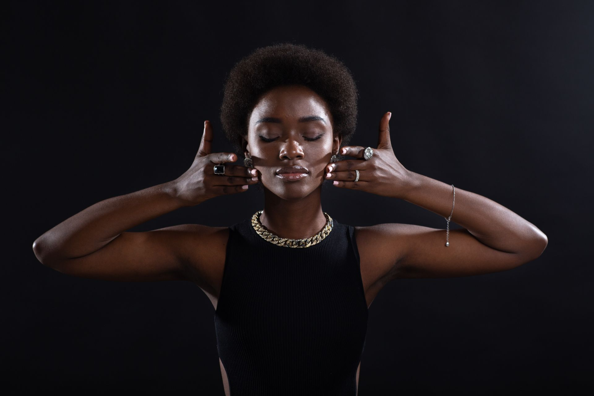 A woman stretching the skin on her face.
