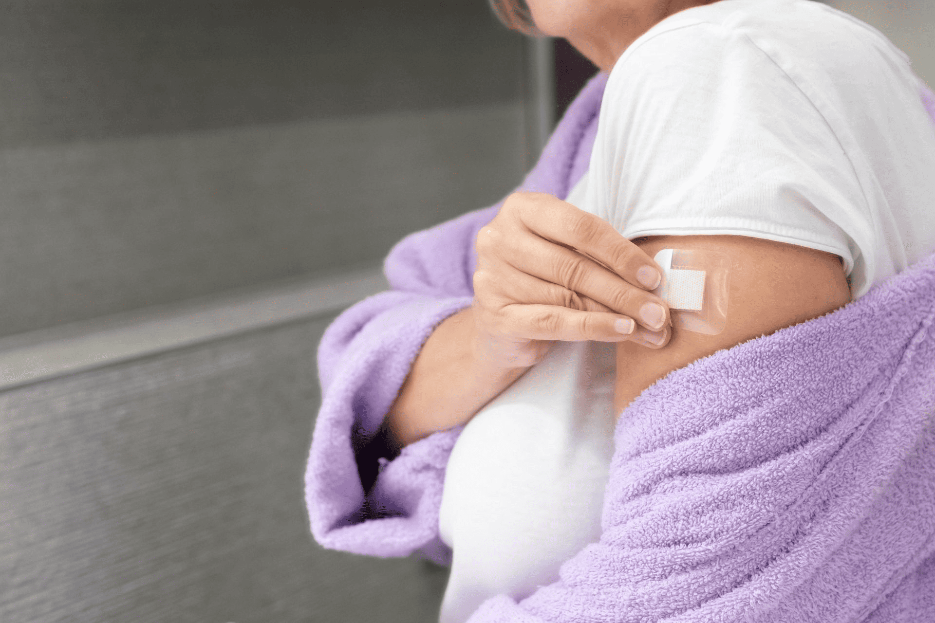  A person administering a TRT patch.
