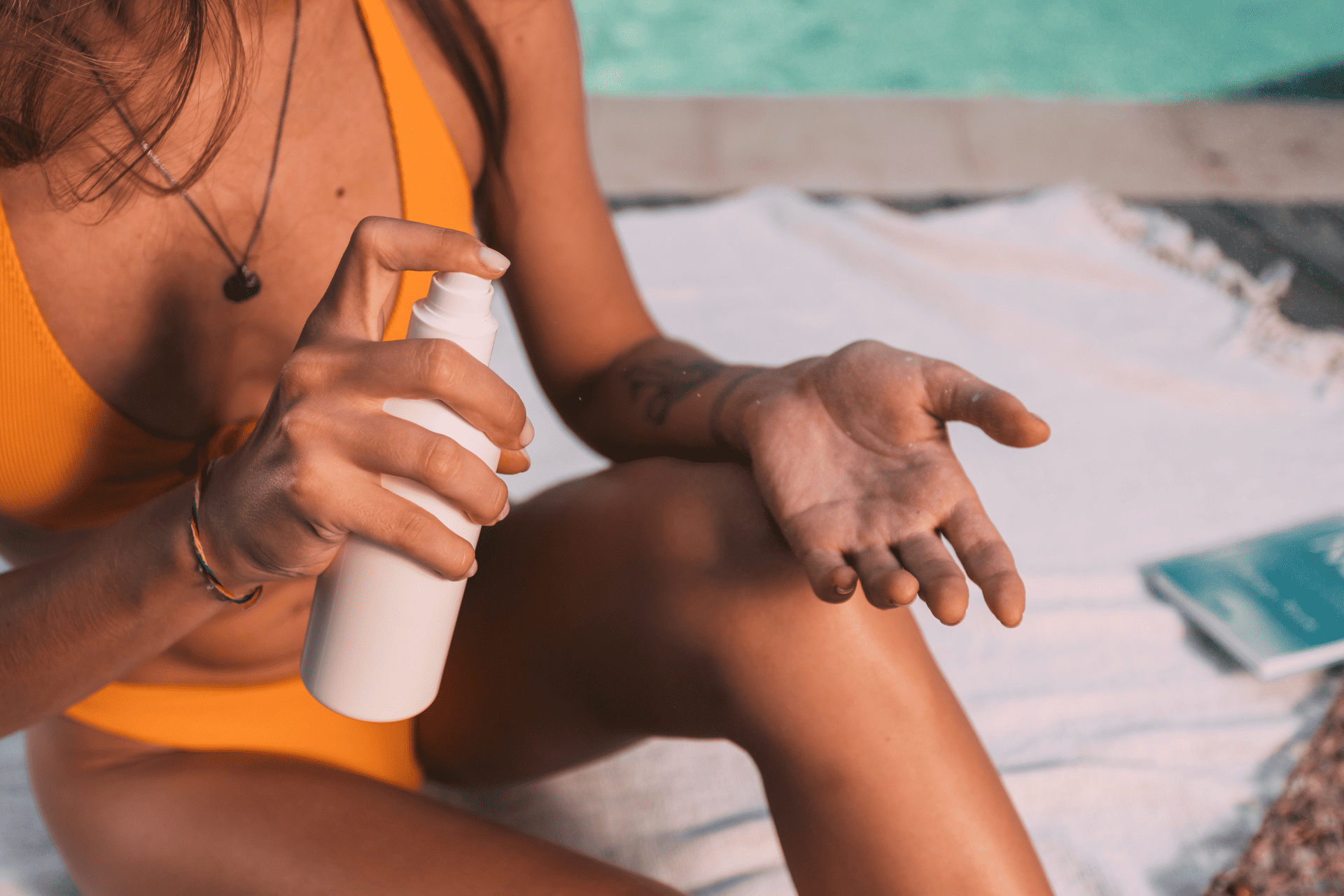 a woman applying medical-grade sunscreen
