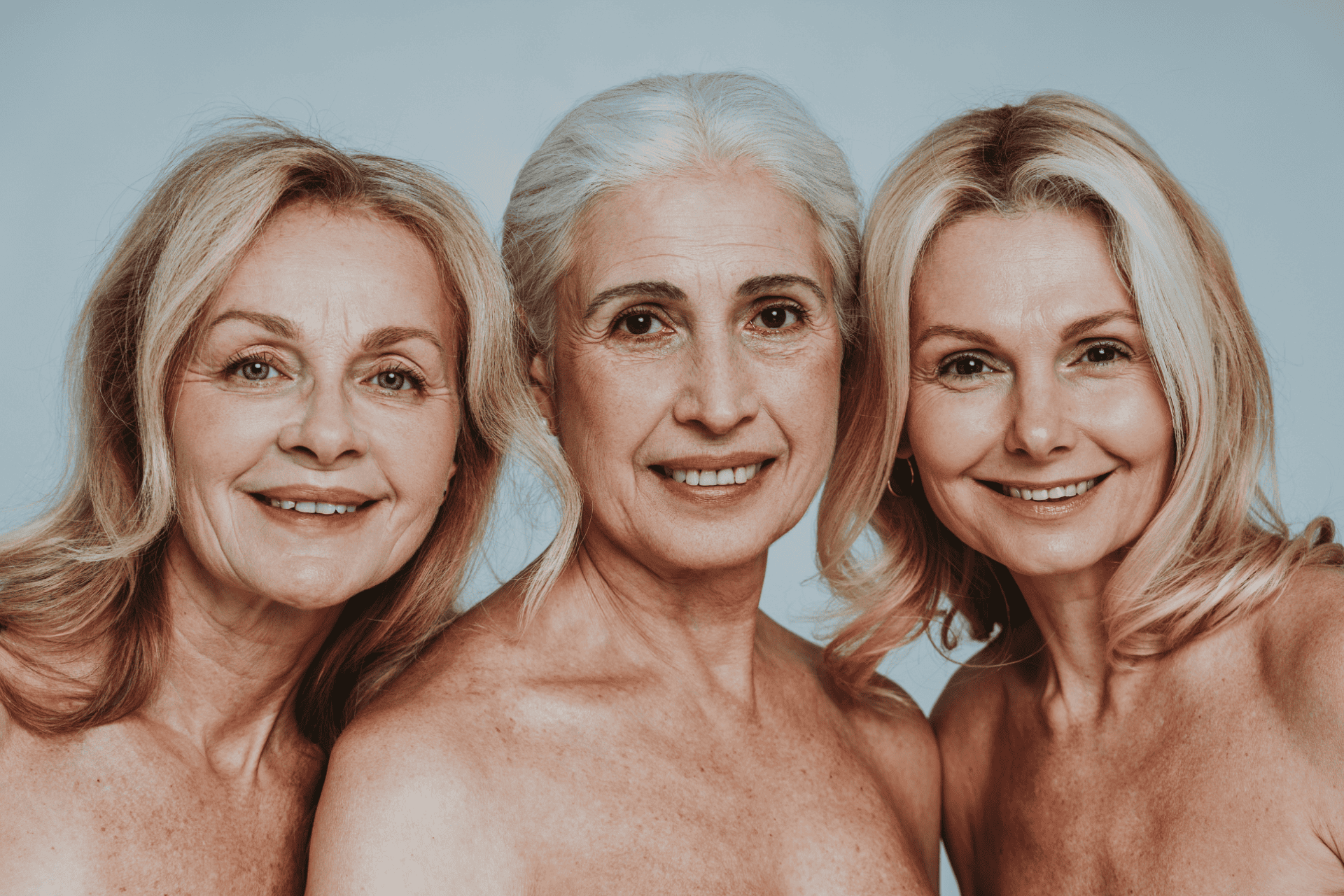 three smiling middle-aged women after taking progesterone therapy